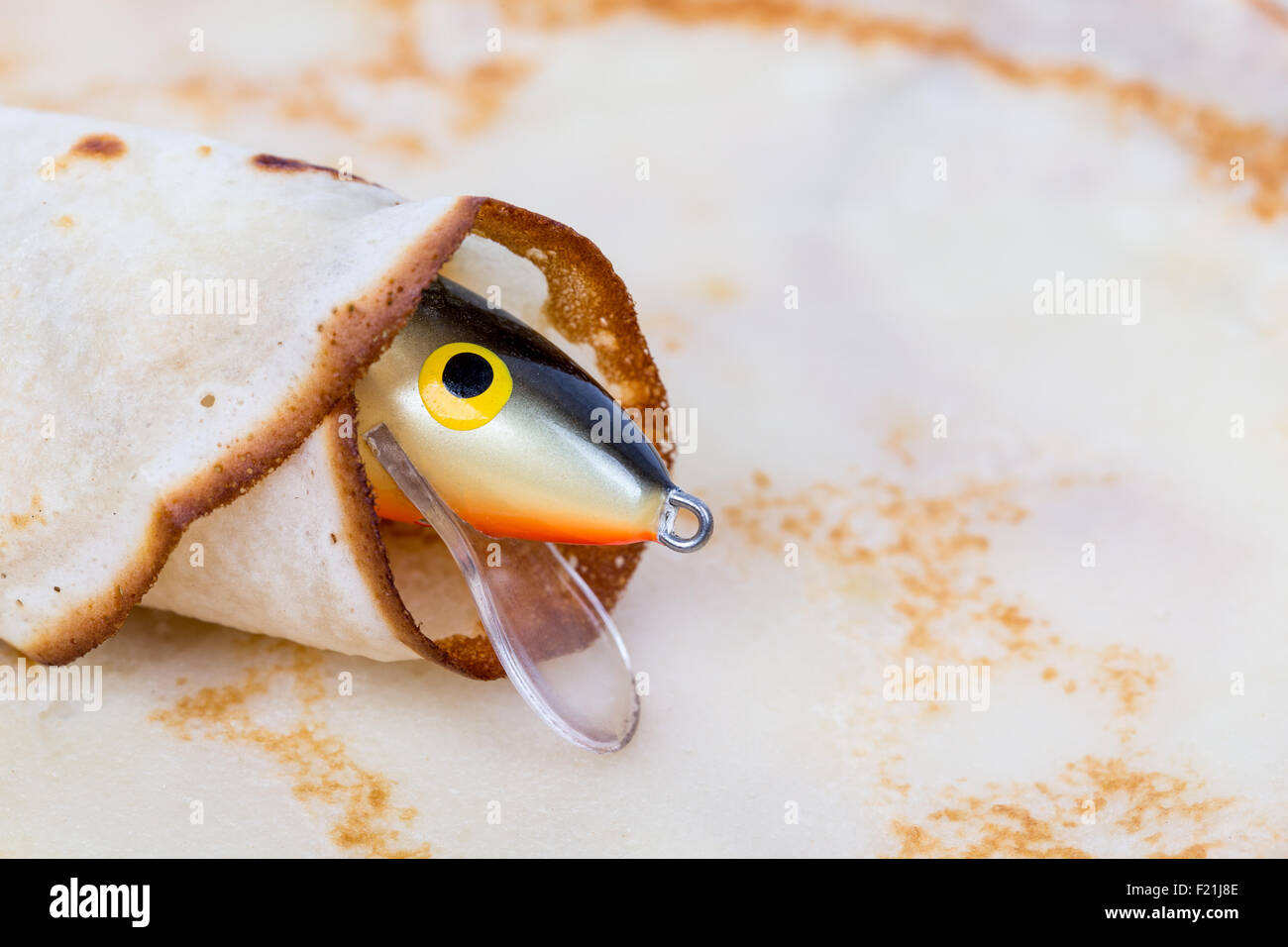 front a fishing tackle lure rolled in pancake Stock Photo