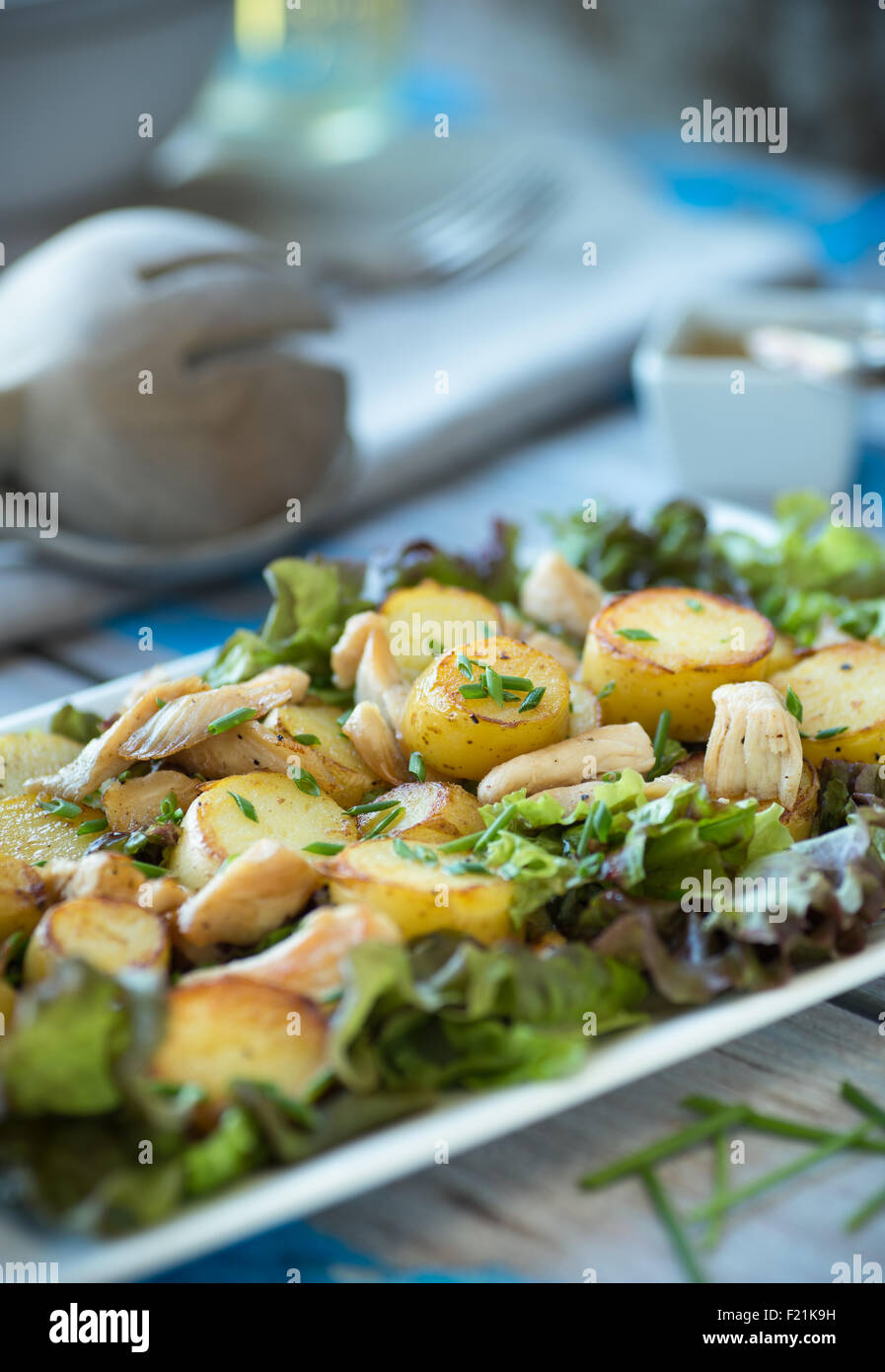 Yukon Gold potatoes with chicken over greens with vinaigrette Stock Photo Alamy