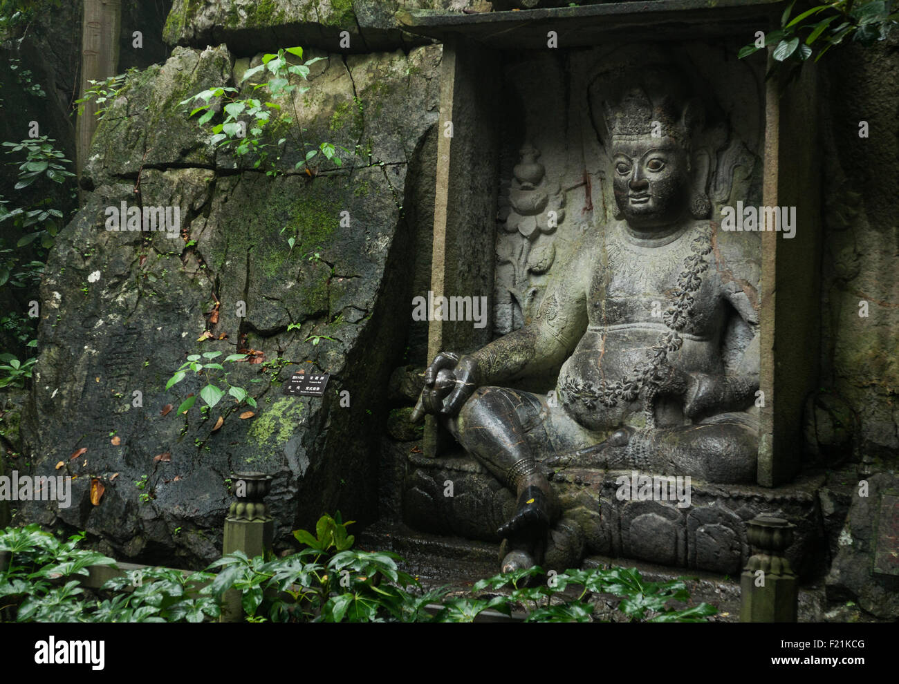 Buddha sculpture carved into Feilai Feng hill at Lingyin Temple, oldest Buddhist temple in China, dating from Ming dynasty AD 32 Stock Photo