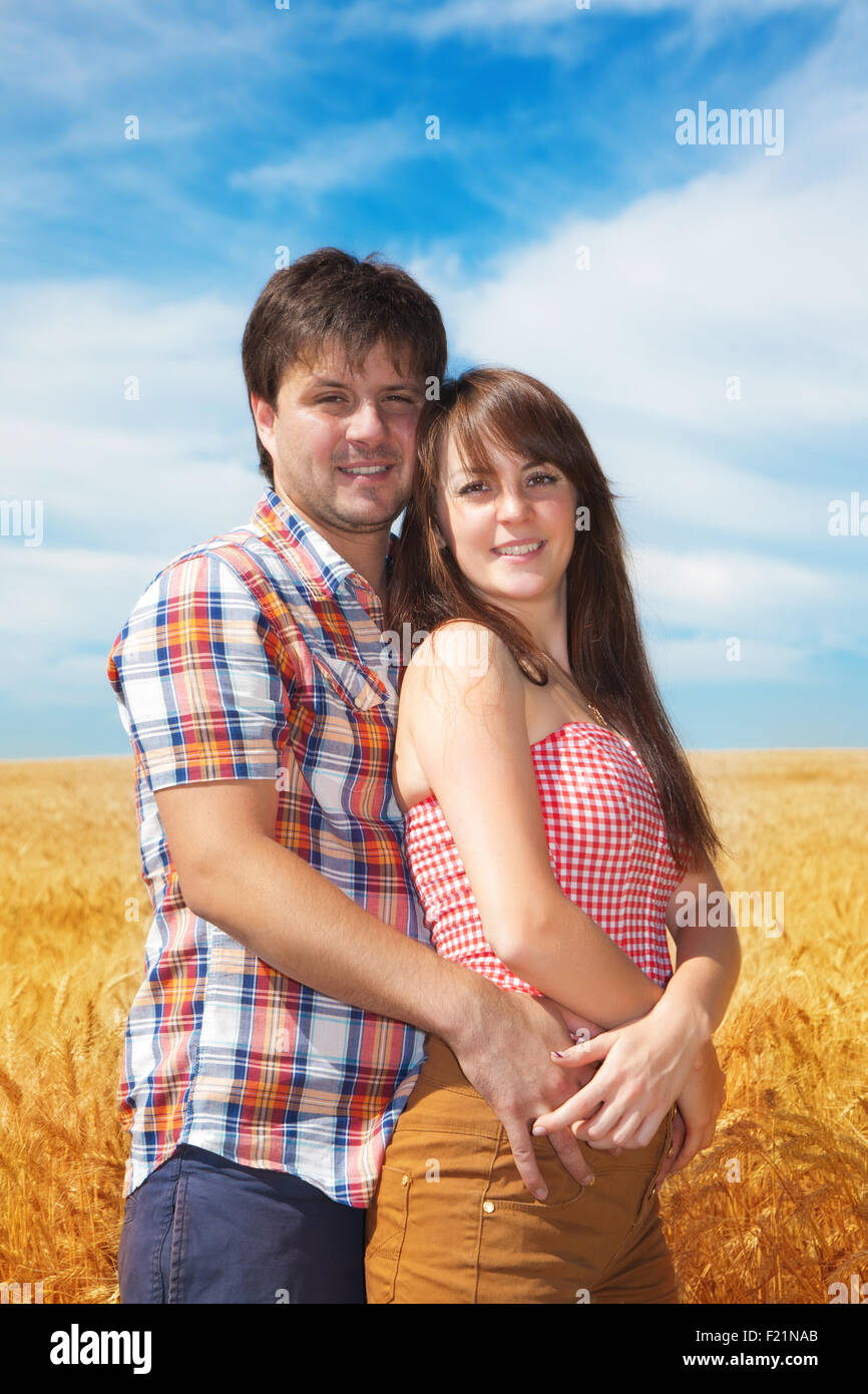 Man and woman on a date in wheat field Stock Photo - Alamy