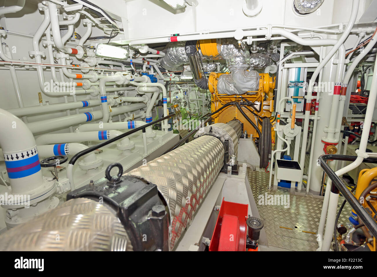 Engine room on a cargo boat ship Stock Photo