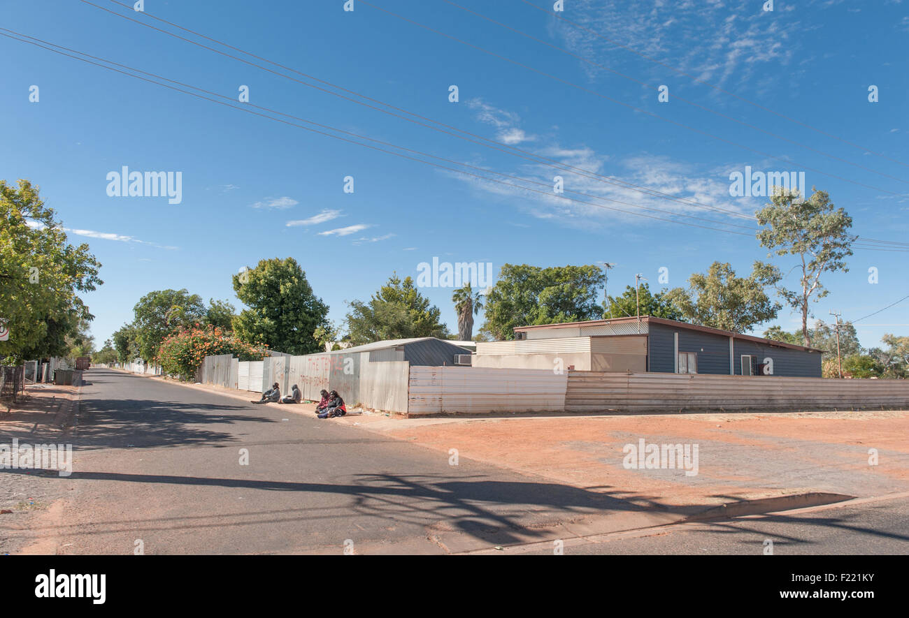 Indigenous peoples squatting on the grounds in the centre of Tennant Creek, Northern Territory, Australia, Stock Photo