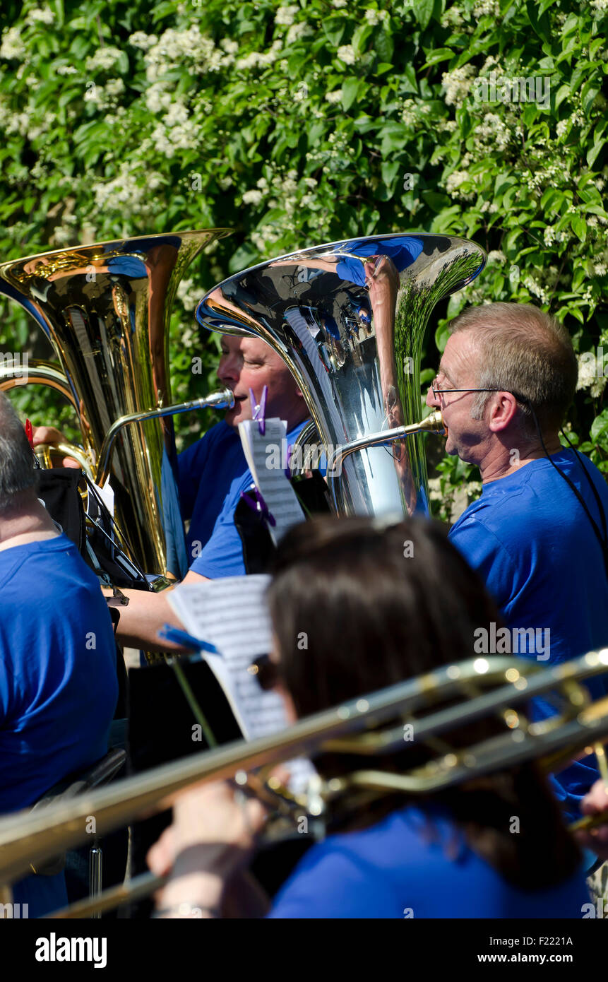 Tuba players with the Johnstone Brass Band playing at the Water of