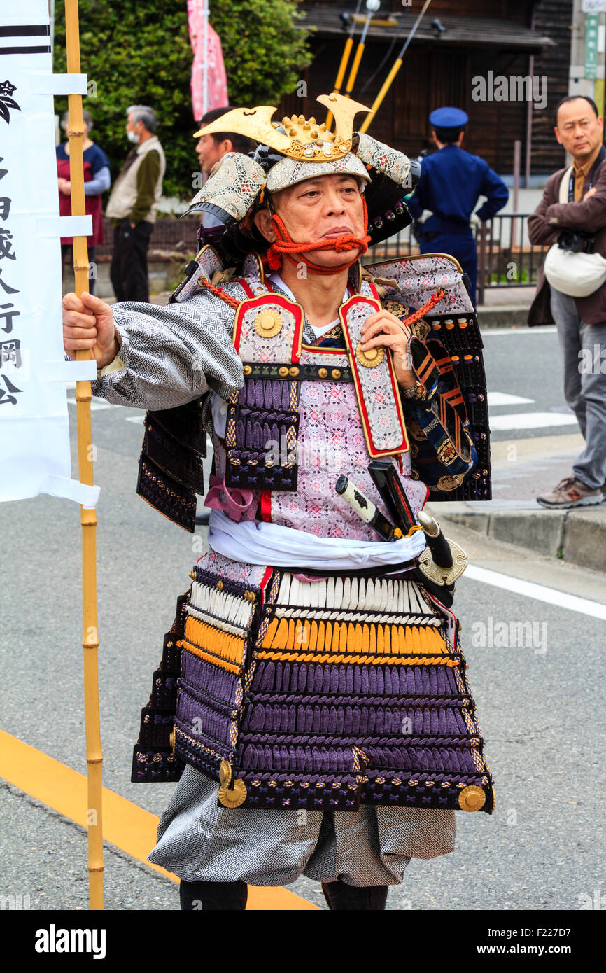 Genji festival parade in Japan. Japanese men dressed as samurai in full