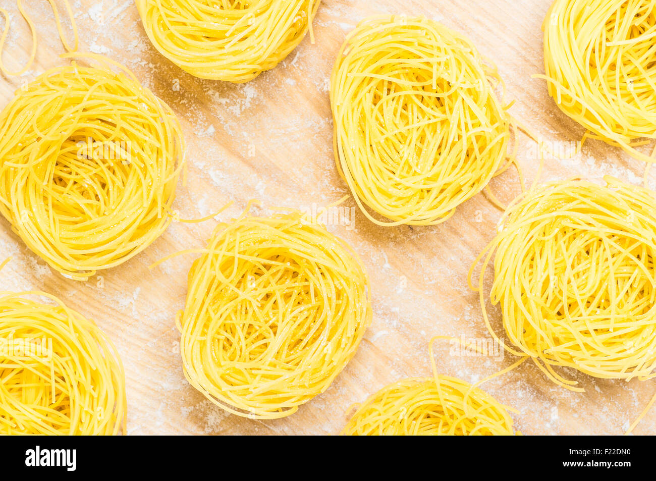 Nests Capellini pasta top view of the board with flour Stock Photo Alamy