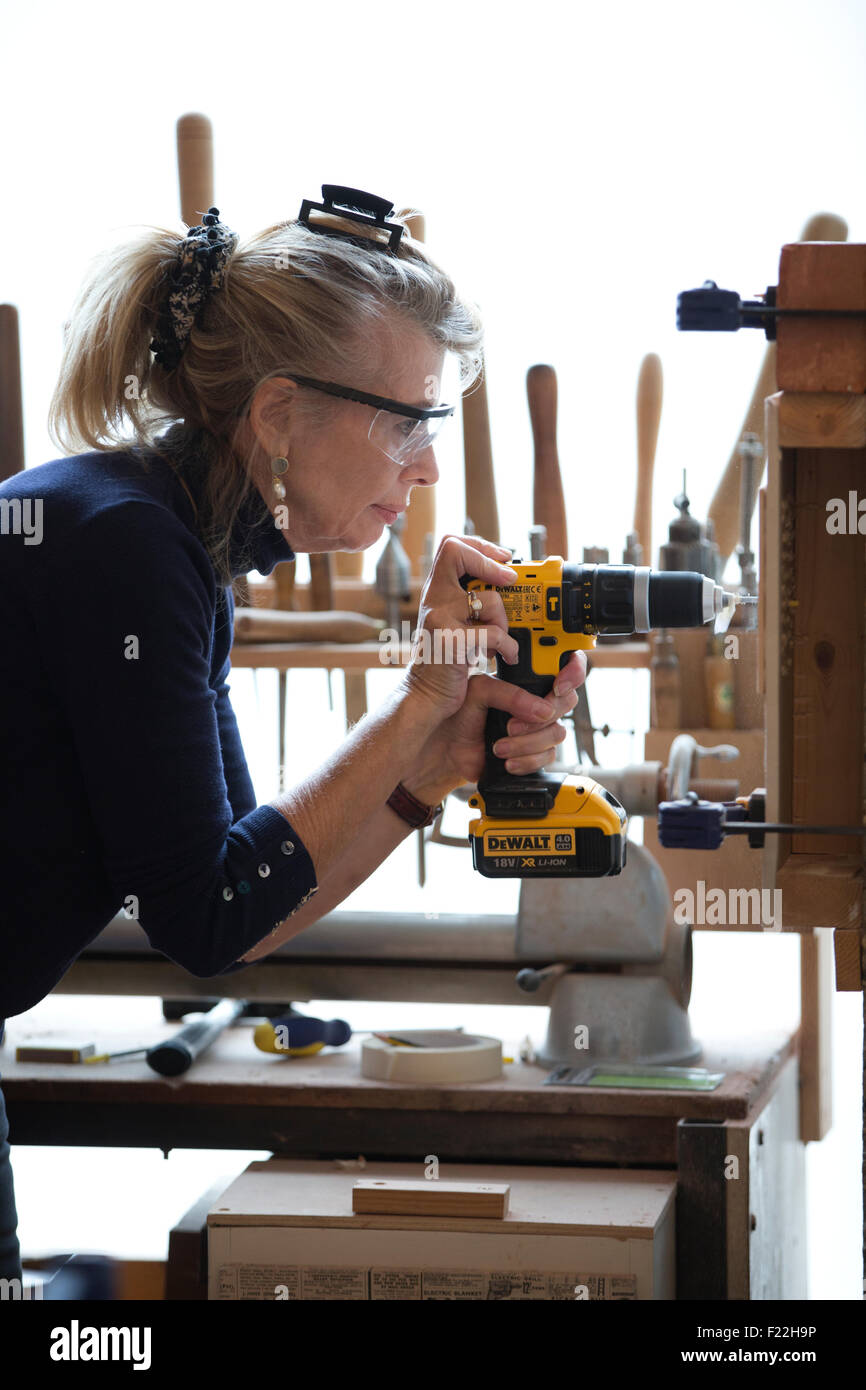Middle aged people attending a Do-It-Yourself course learning basic carpentry skills, UK Stock Photo