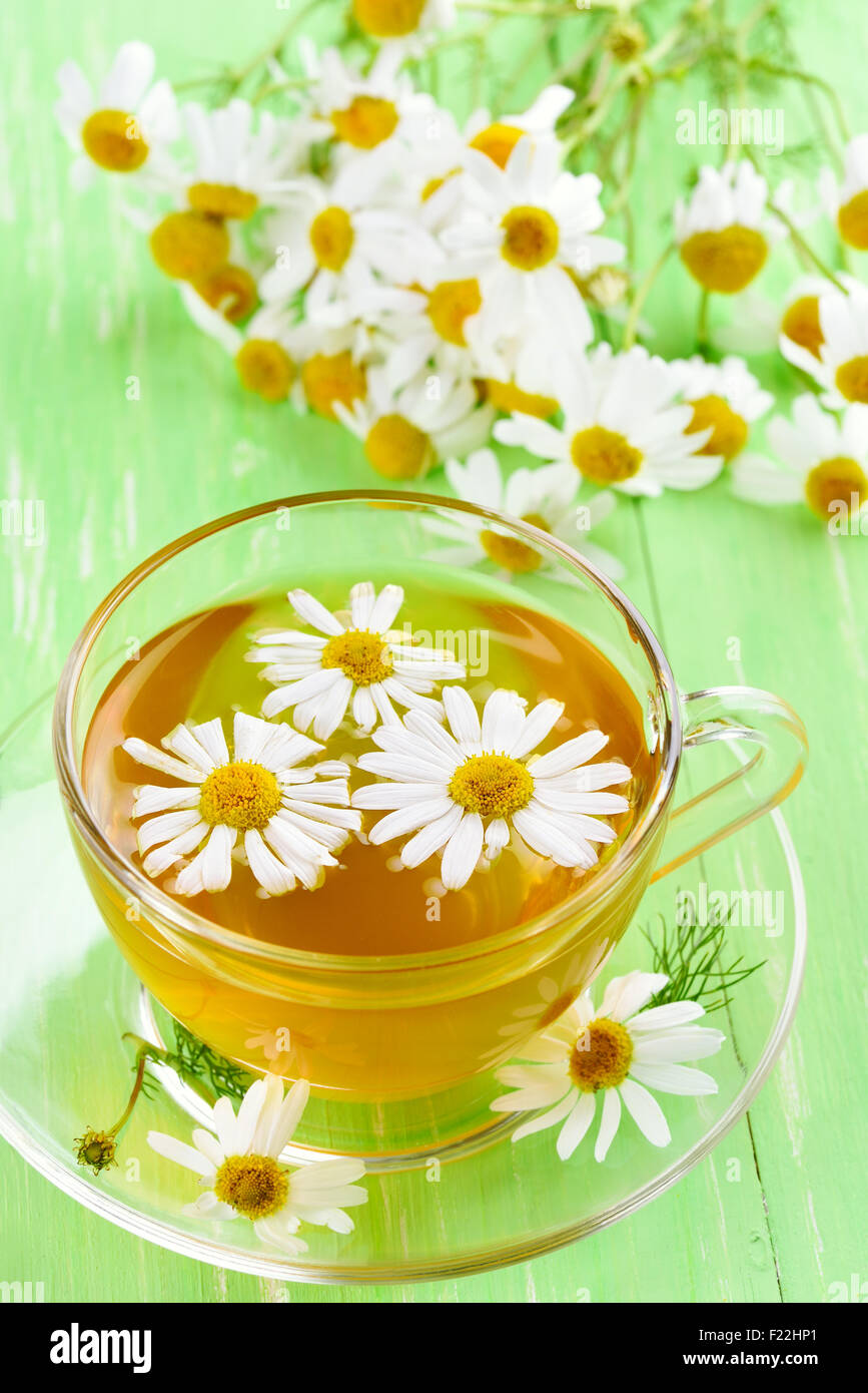 Cup of herbal tea with chamomile flowers Stock Photo - Alamy
