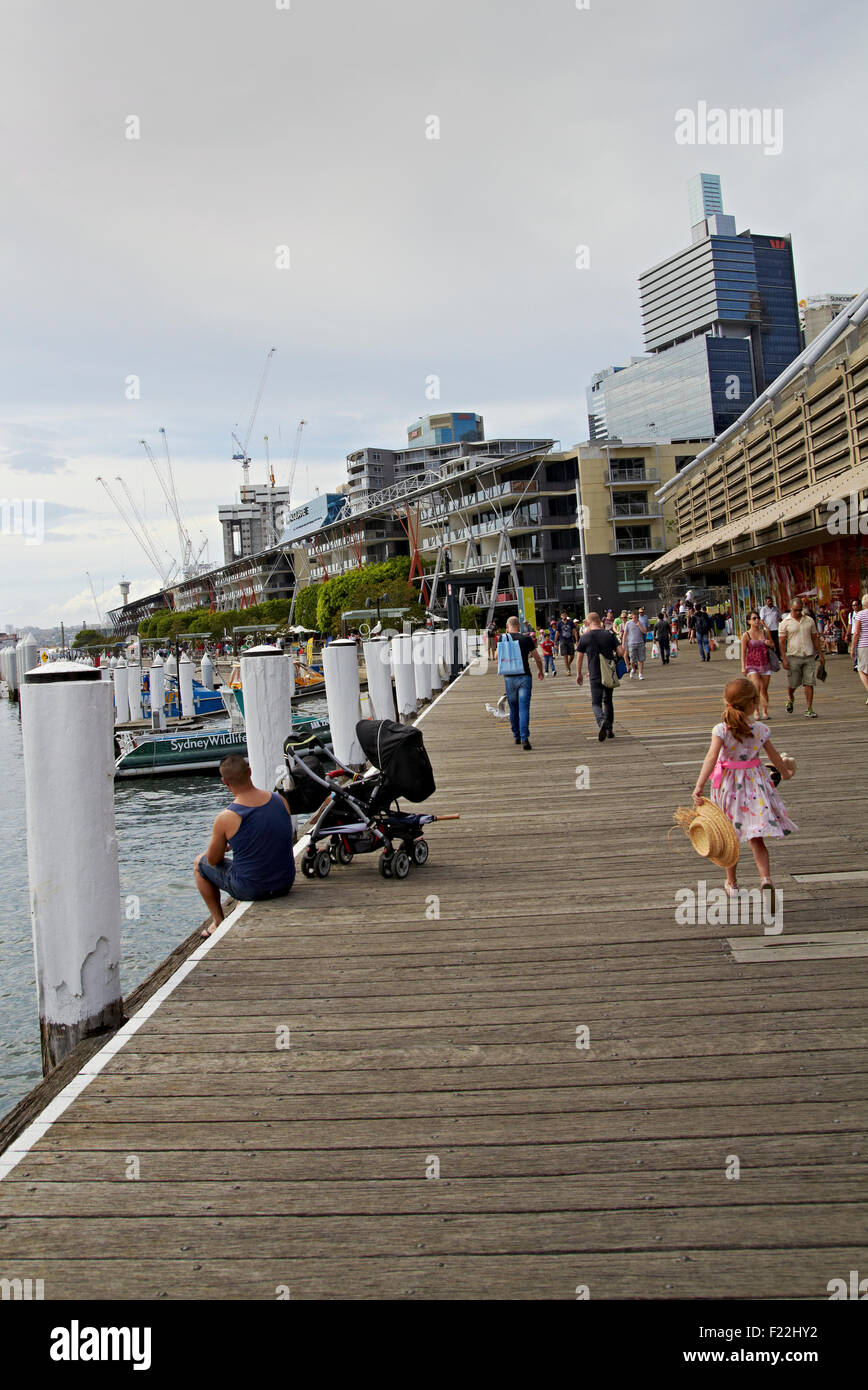 People at Darling Harbour Water Front Sydney NSW Australia Little Girl Red Stock Photo
