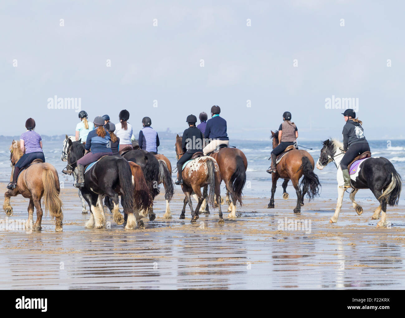 Horse riding on Saltburn beach. Saltburn by the sea, North Yorkshire, England. UK Stock Photo