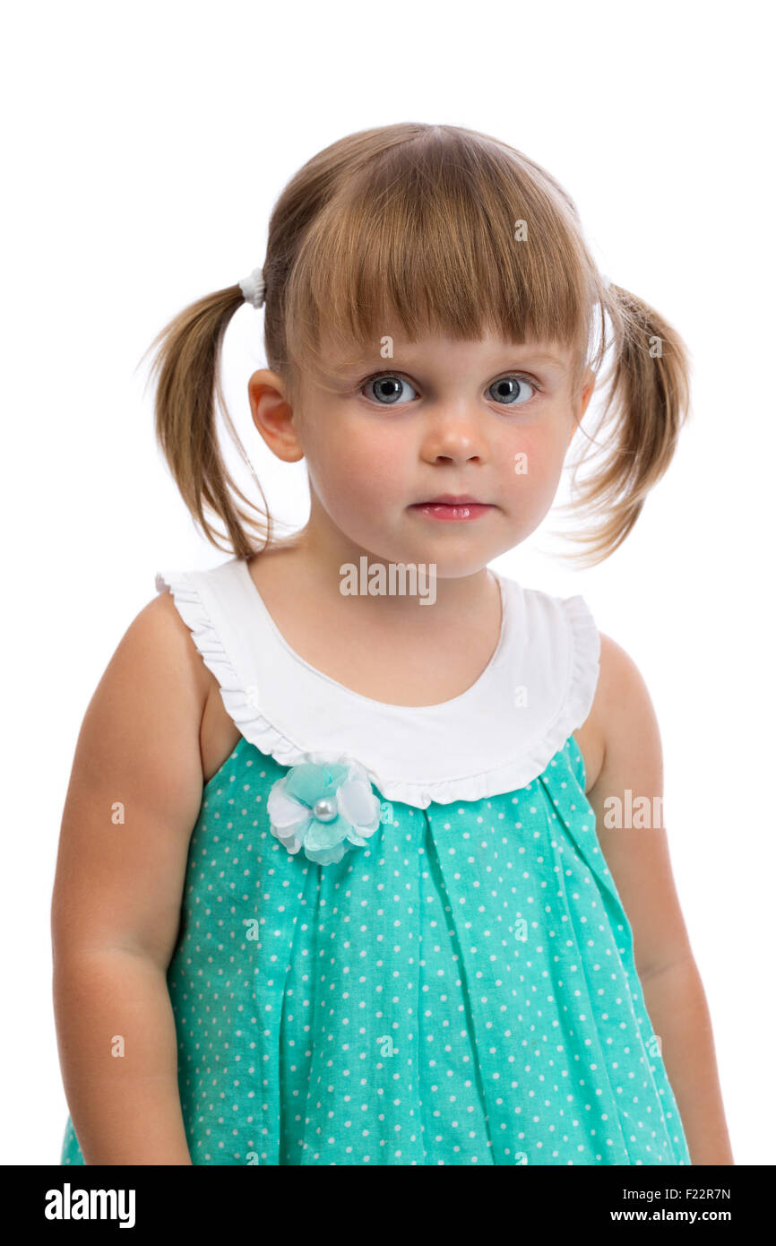 Portrait of a little three year old charming girl in the studio on a white background. Isolate on white. Stock Photo