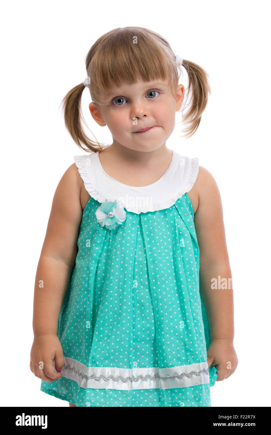 Portrait of a little three year old charming girl in the studio on a white background. Isolate. Stock Photo