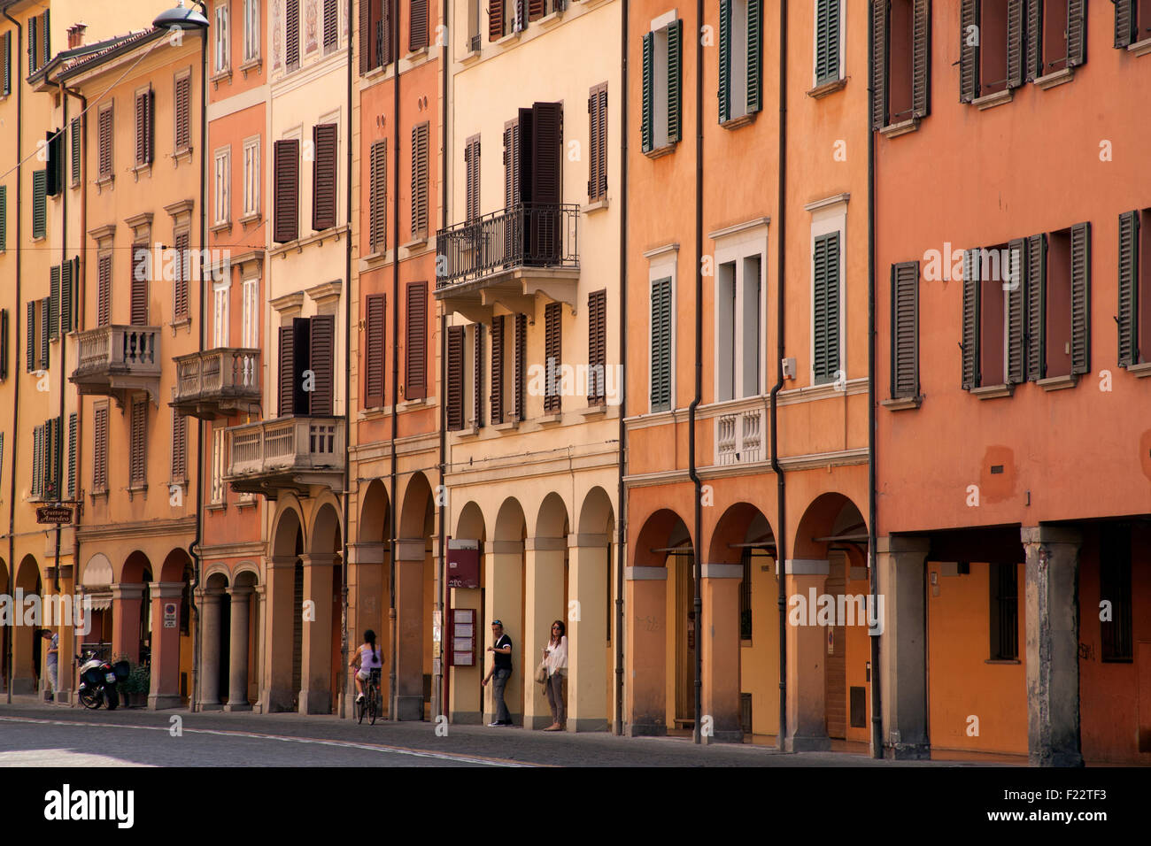 Orange porticoed buildings on Via Saragozza Bologna Emilia-Romagna, Italy Stock Photo