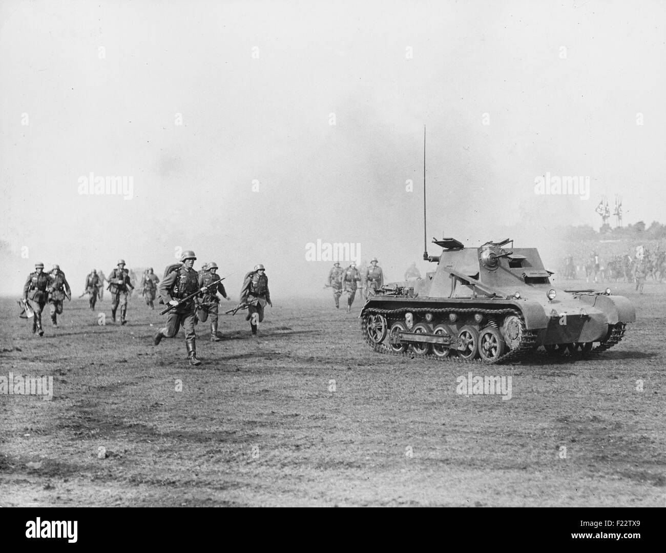 On the day of the Wehrmacht on the Nuremberg Rally in Nuremberg soldiers present an attack on the Zeppelin Field, with the help of tanks. The tank is a Panzer I conducting as Panzerbefehlswagen ('small armored command vehicle'). Stock Photo