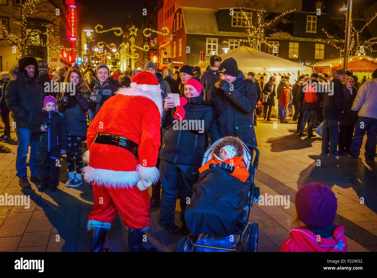 Taking pictures of Santa Claus at a Christmas Market, Reykjavik, Iceland Stock Photo