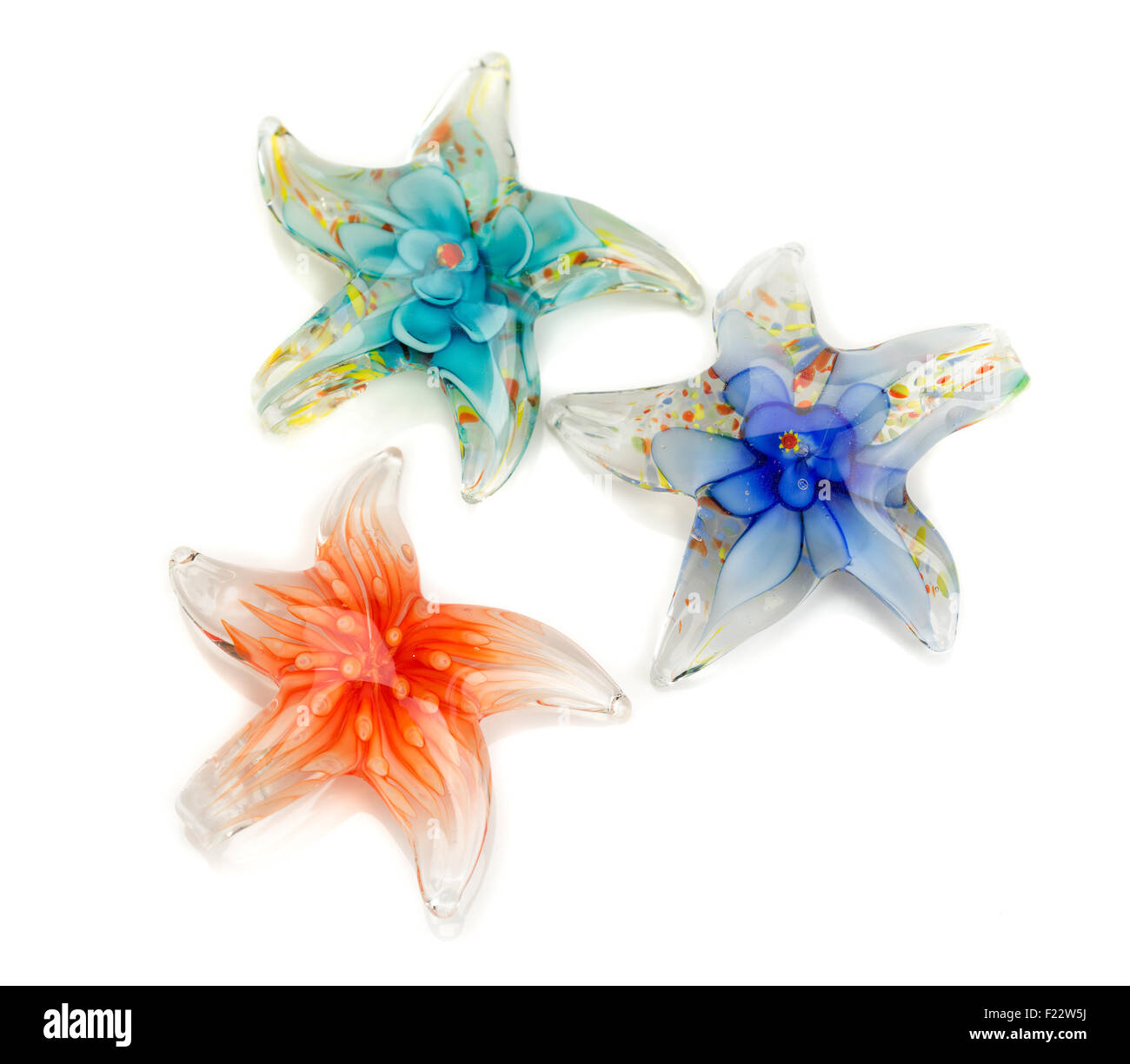 Three stars out of Murano glass isolated on white background. Stock Photo