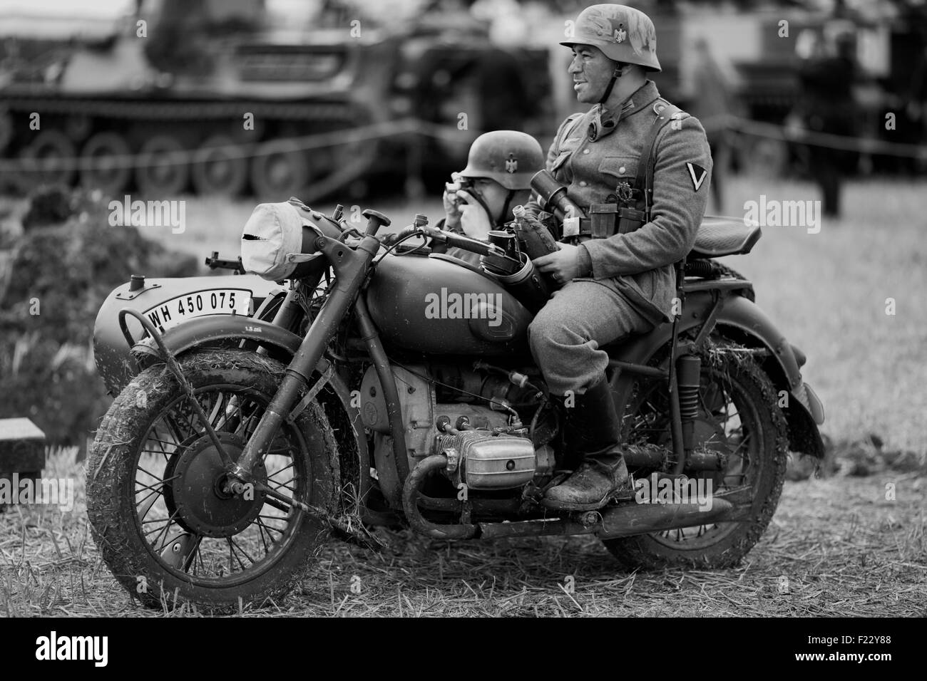 World war 11 German soldiers on A BMW Motorcycle with sidecar  on the Battlefield Stock Photo