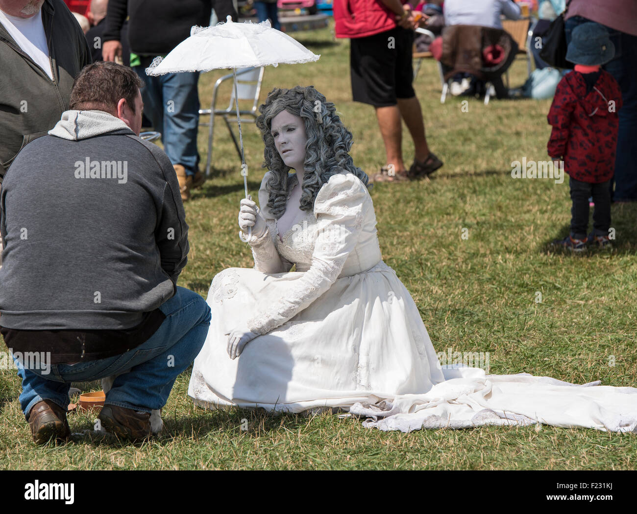 Lady dressed as a clockwork doll at Steam rally and Country fair Stow ...