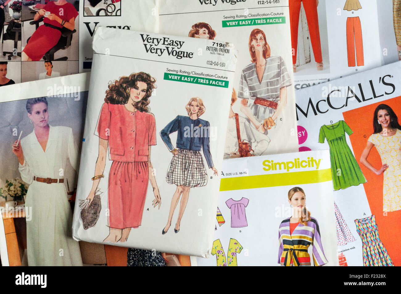 A collection of printed paper dressmaking patterns. Stock Photo