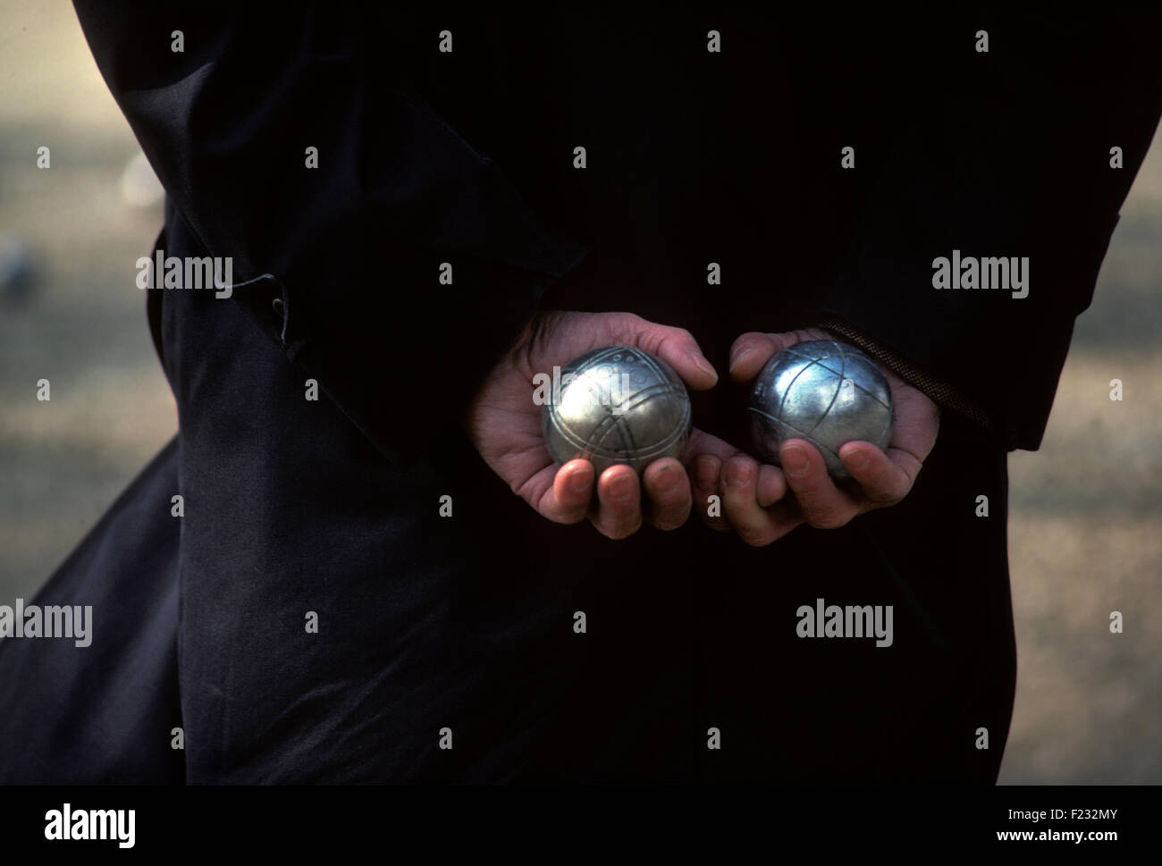 Pétanque is a form of boules where the goal is to throw hollow metal