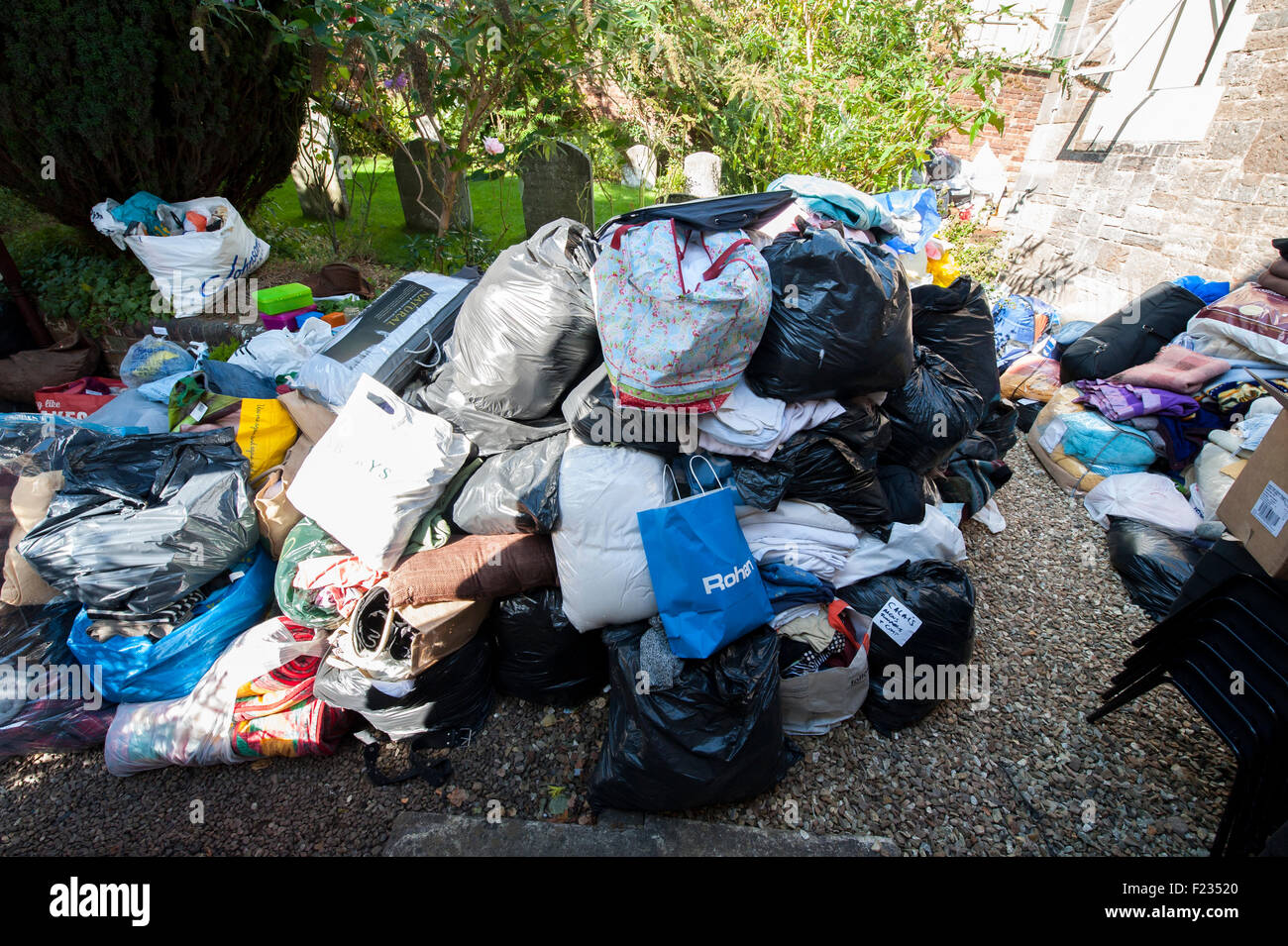 Exeter, UK. 10th Sep, 2015. The donated clothes expanded to the outside of the Quaker Hall during the Exeter Calais Solidarity collection for refugees living in 'The Jungle' refguee camp in Calais Credit:  Clive Chilvers/Alamy Live News Stock Photo