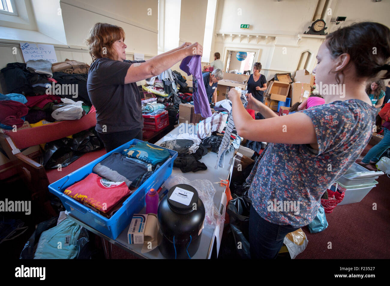 Exeter, UK. 10th Sep, 2015. Collection organiser Alison Williams, checks donated clothes during the Exeter Calais Solidarity collection for refugees living in 'The Jungle' refguee camp in Calais Credit:  Clive Chilvers/Alamy Live News Stock Photo