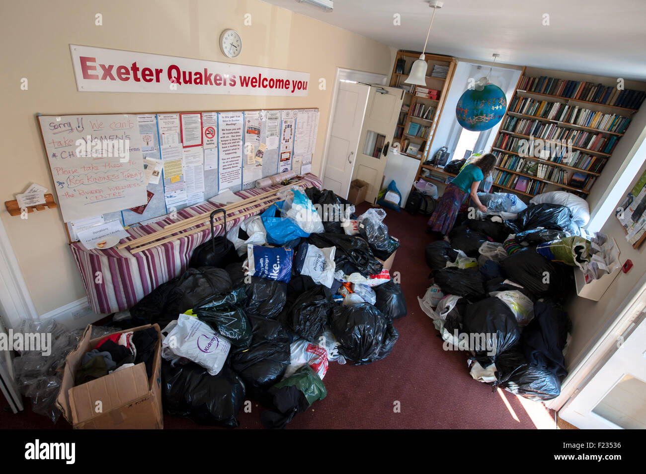 Exeter, UK. 10th Sep, 2015. The entrance hall of the Quaker Meeting House is filled with donated clothes during the Exeter Calais Solidarity collection for refugees living in 'The Jungle' refguee camp in Calais Credit:  Clive Chilvers/Alamy Live News Stock Photo