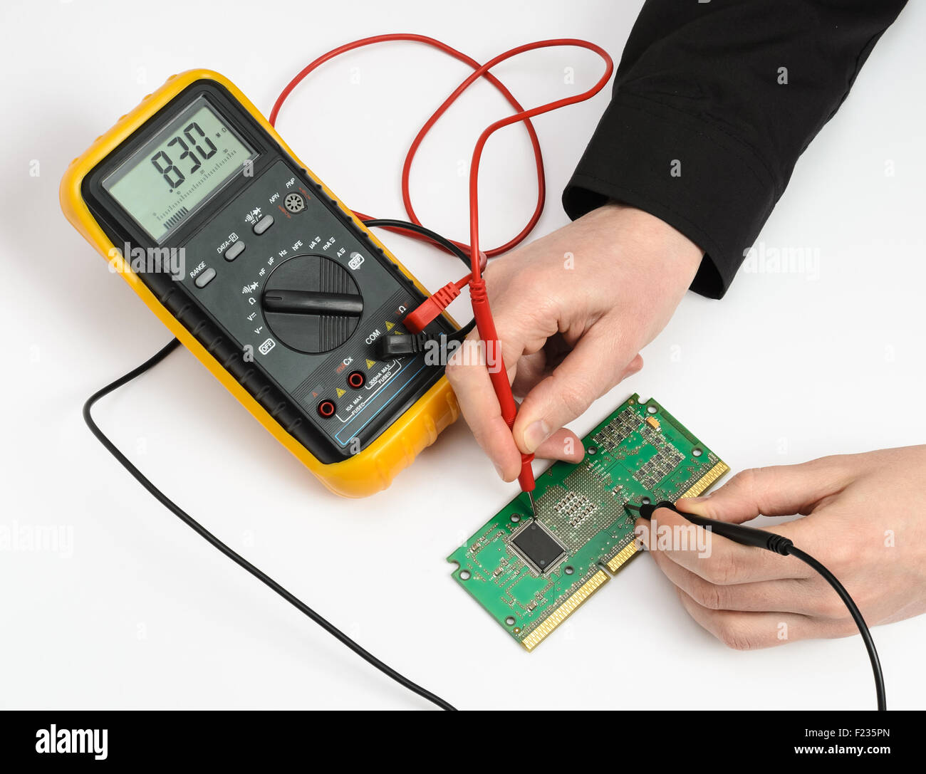 Testing electronic device. Measuring by multimeter Stock Photo Alamy