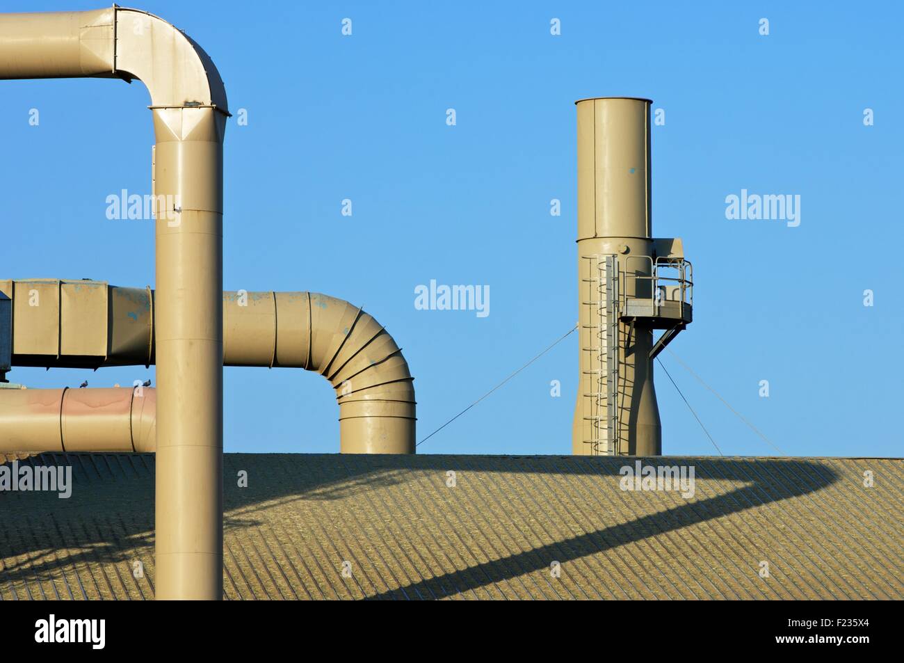 Metal pipes on the facade of a factory Stock Photo Alamy