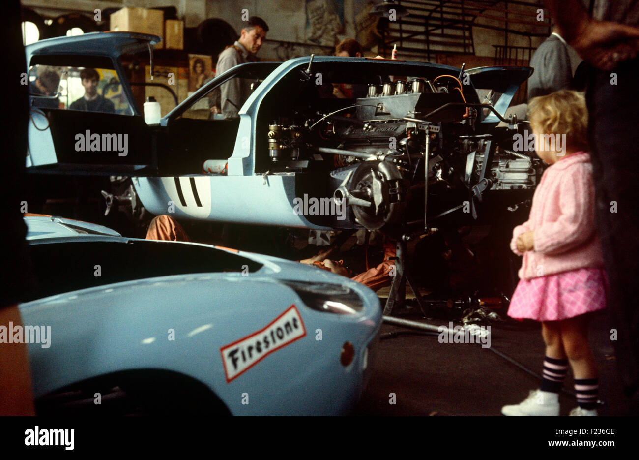 Car 11 in background is Gulf JW team Ford GT40 in the team garage, co-driven by Brian Muir Jackie Oliver 29 September 1968 Stock Photo