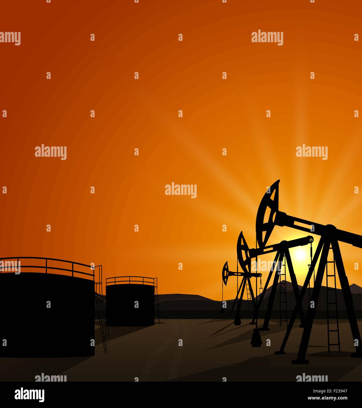 Oil pump jack for petroleum and reserve tanks on sunrise backgro Stock