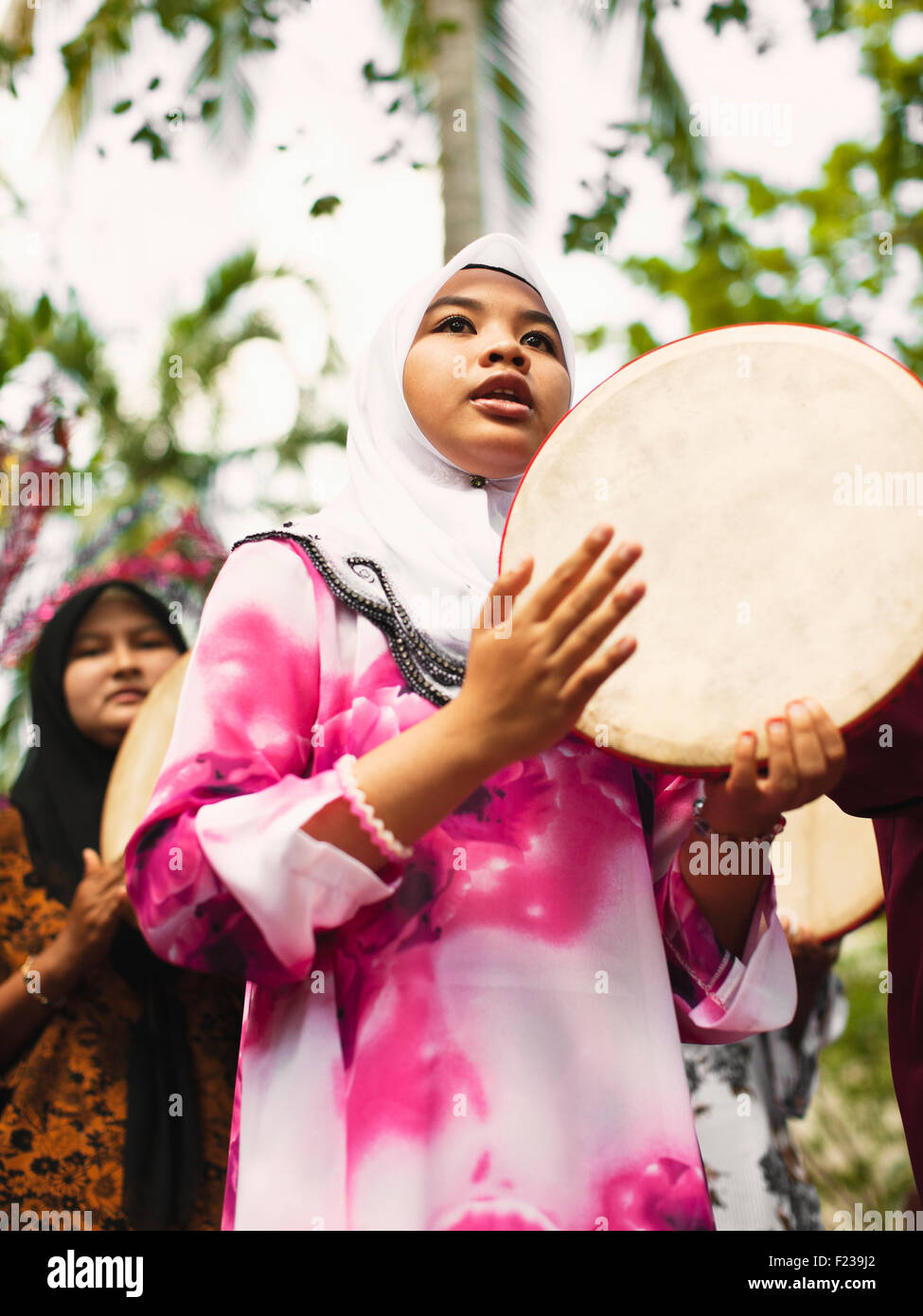 The daily Mandi Bunga ceremony is part of a Malaysian Sucimrni ritual to enhance the traditional Malay healing process. Stock Photo