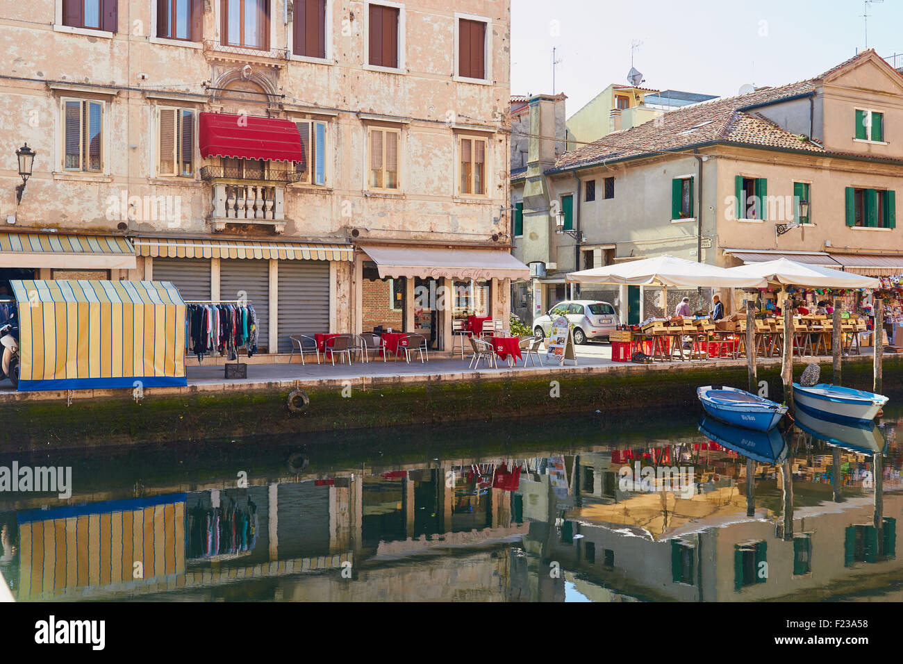 Canalside market stalls and cafes Chioggia Venetian Lagoon Veneto Italy Europe Stock Photo