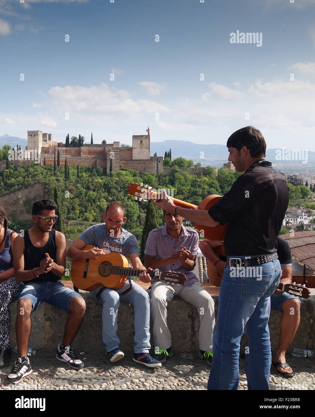 Granada Spain men playing guitar and singing spanish street music Stock Photo