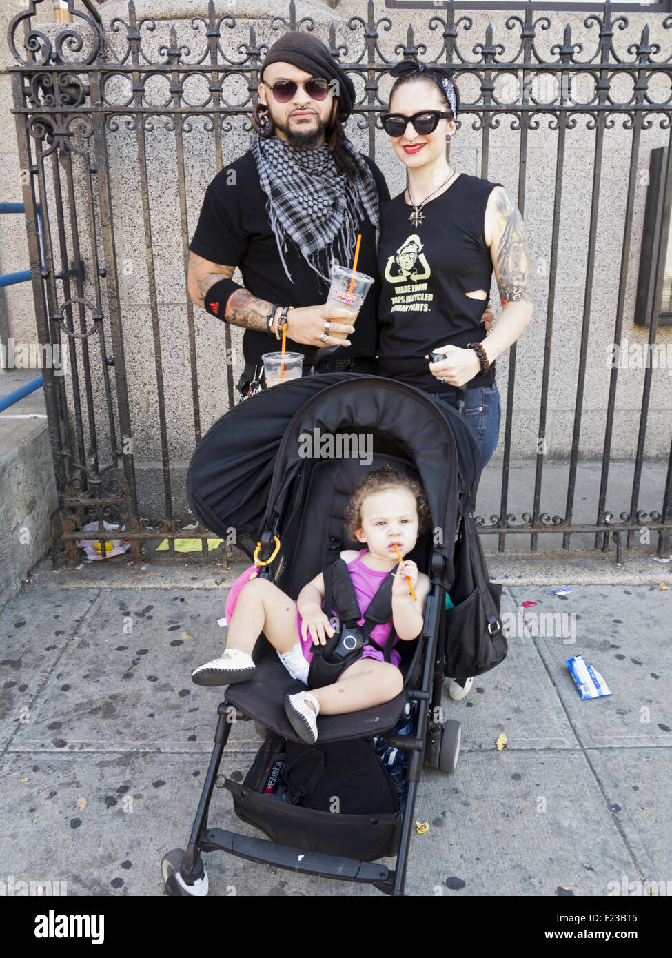 Hip couple with young daughter in the Williamsburg section of Brooklyn, New York. Stock Photo