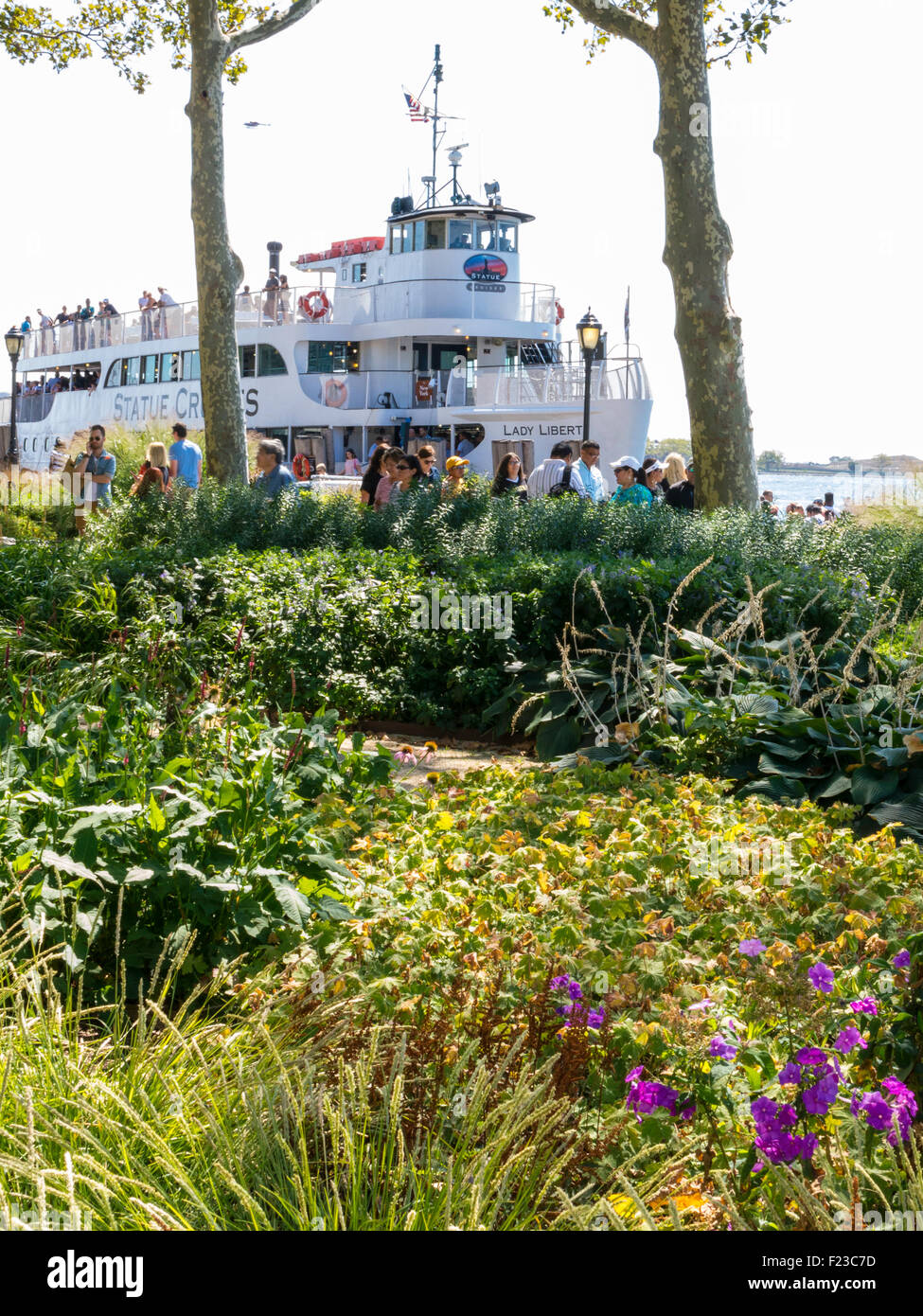 Battery Park with Statue of Liberty Ferry in Background, NYC Stock Photo Alamy