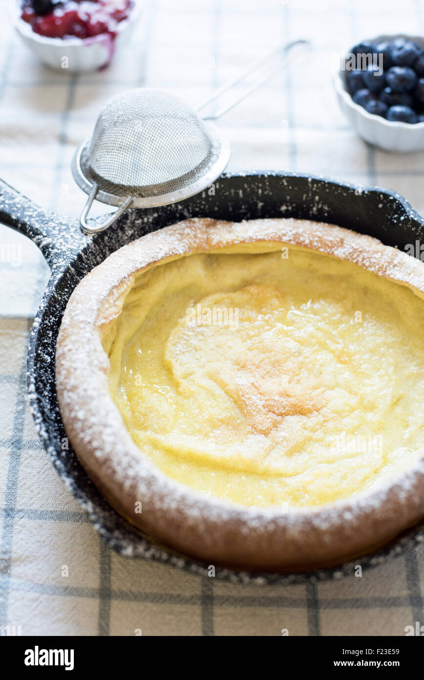 Dutch baby pancake in cast iron skillet hires stock photography and