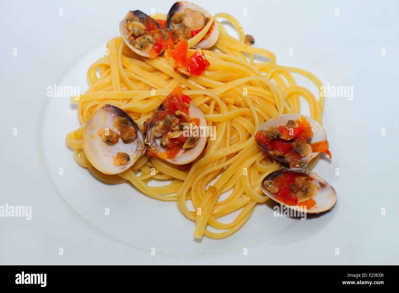 Italian spaghetti, italian pasta with tomato, italian pasta with mussels and clams, Stock Photo