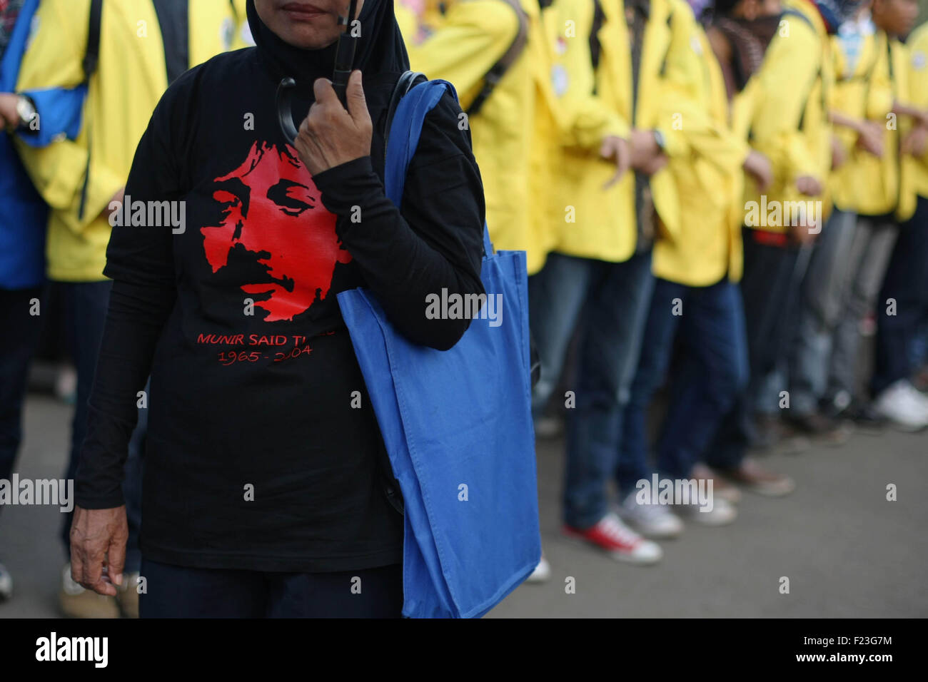 Central Jakarta, Jakarta, Indonesia. 14th Feb, 2013. Human rights activists during the gathered for the 411th time in front of the Presidential Palace in Jakarta for the weekly Kamisan (Thursdays). Kamisan (with black umbrella is symbol) was initiated in January 2007 by families of victims of human rights violations, and is supported by human rights organisations such as The Commission for the Disappeared and Victims of Violence (KontraS). The protest brings together individuals concerned with various human rights cases: from those committed during Soeharto's New Order, such as the 1965/196 Stock Photo