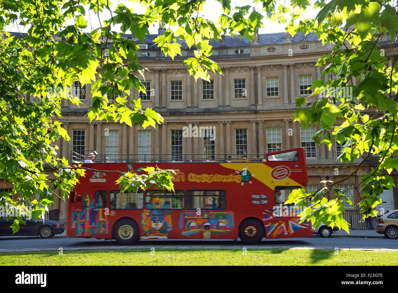 The city of Bath views, including abbey churchyard and the circus with tourist bus. a UK visit visitors cities 'Bath Abbey' Stock Photo
