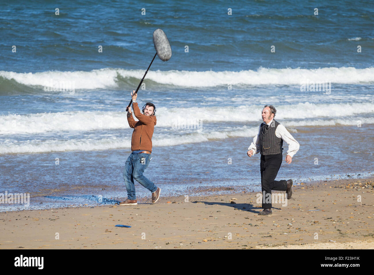Saltburn by the sea, North Yorkshire, UK. 10th September, 2015. Weather: Actor Alun Armstrong, filming new ITV drama Dark Angel on Saltburn beach in glorious weather on the North Yorkshire coast. Credit:  Alan Dawson News/Alamy Live News Stock Photo