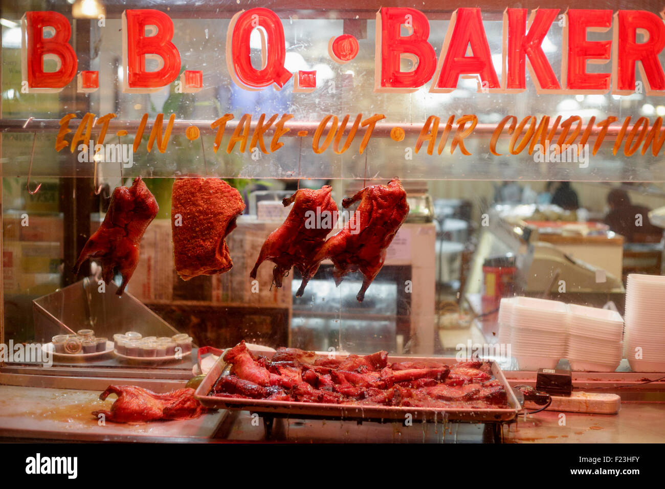 Barbecued meats hanging in window of Chinese restaurant-Victoria, British Columbia, Canada. Stock Photo