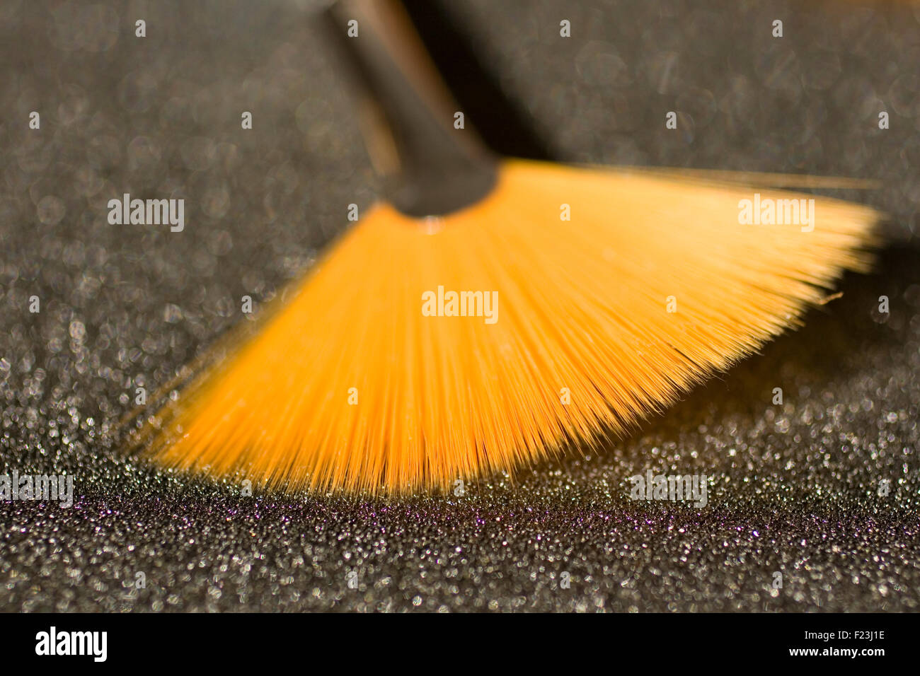 Fan shaped paintbrushes on anthracite background Stock Photo