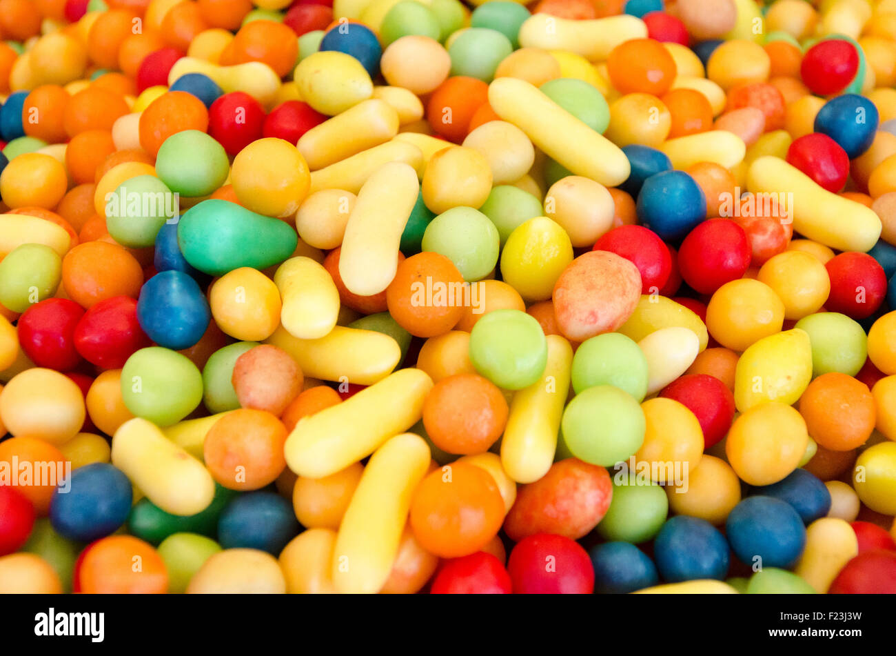 Mix fruit sweets and colorful background Stock Photo Alamy