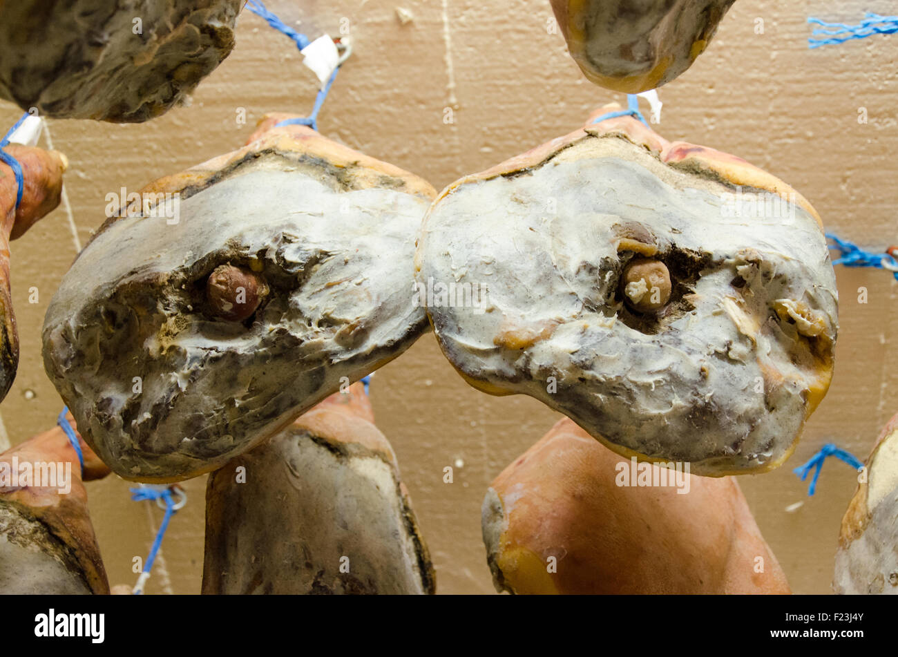 Entire Bayonne ham jamon drying, hanging at the ceiling Stock Photo