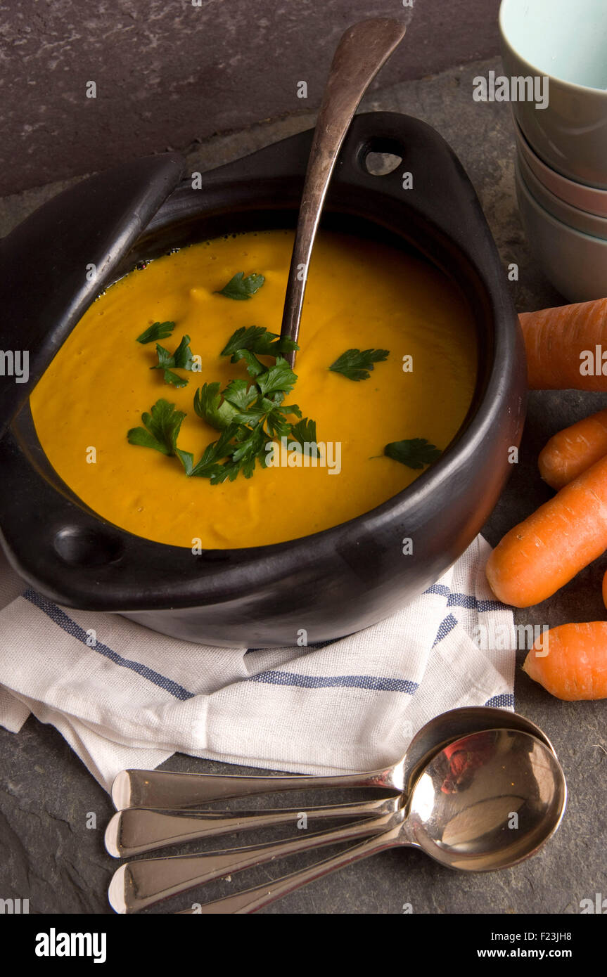 Carrot soup, a vegetarian meal in a deep bowl, often served as a a starter course. 'small plate' 'small dish' a UK food cuisine Stock Photo