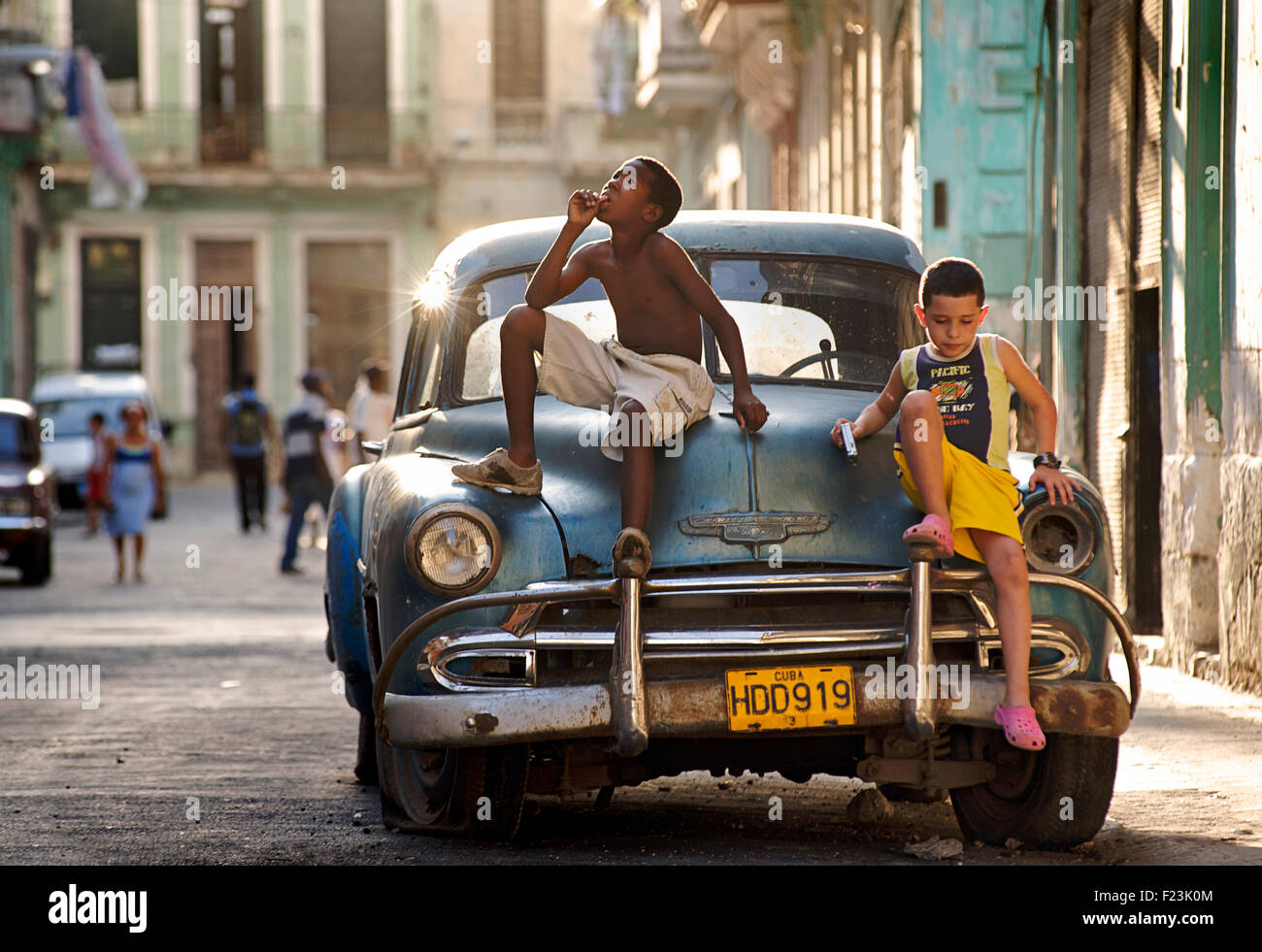 Cuban kids on a classic American car. CHEVROLET. A cultural icon for modern day Cuba. Havana, Cuba Stock Photo