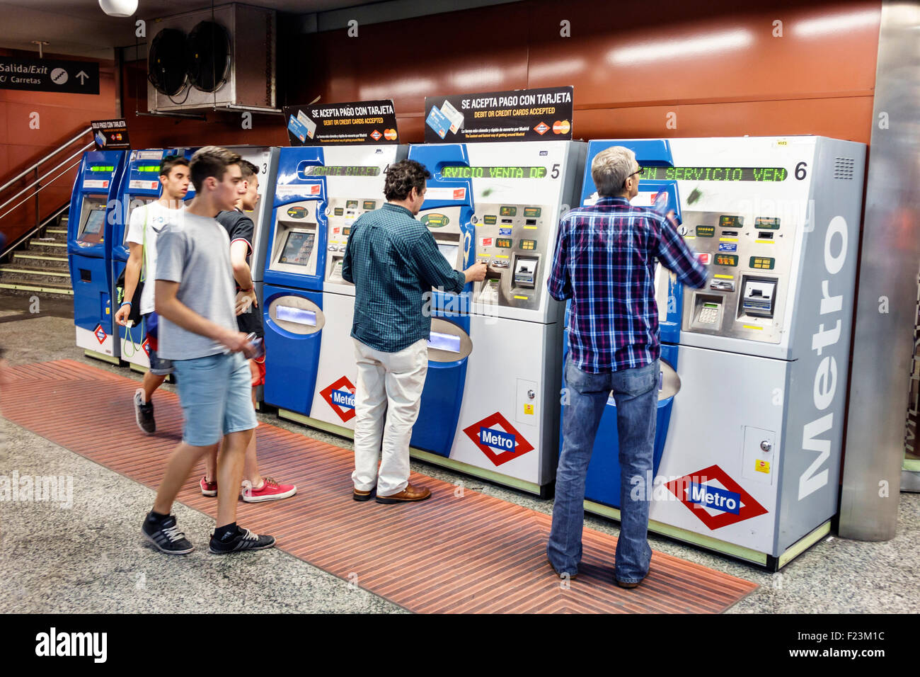 Madrid Spain,Hispanic Centro,Vodafone Sol Metro Station,subway,train,fare card,vending machine,ticket,Hispanic man men male,Spain150630179 Stock Photo