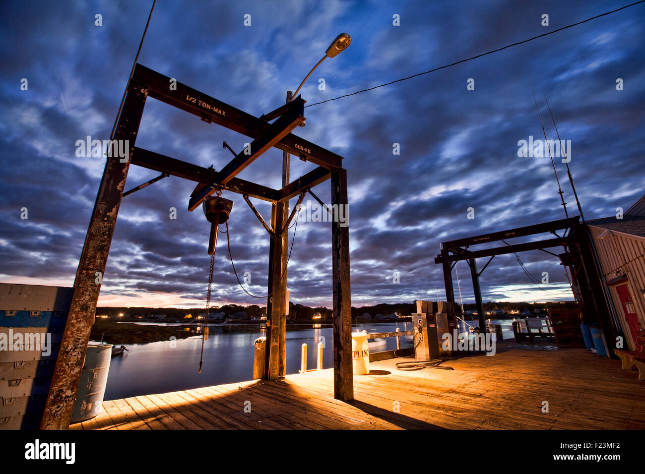 Looking up at the loading docks in Cape Porpoise Harbor in Southern Maine, just after sunset Stock Photo