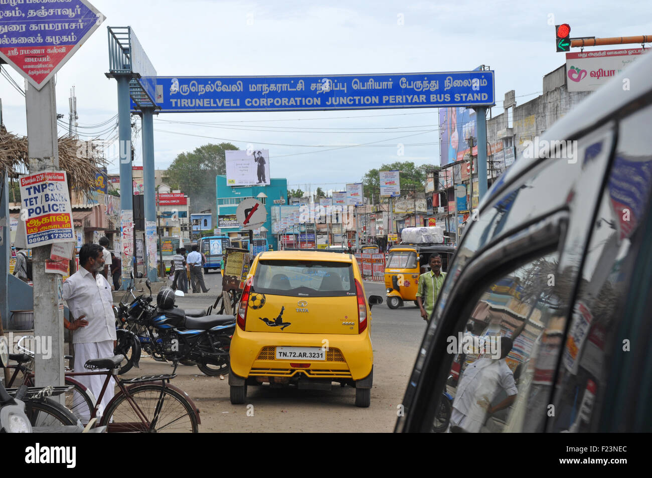 TAMIL NADU, INDIA, AUGUST 22, 2015: Traffic and pedestrians clash in the streets  in Tirunelveli, Tamil Nadu, India. Stock Photo