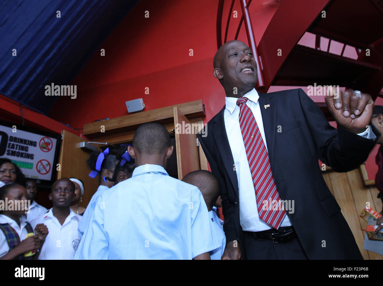 Port of Spain, Trinidad & Tobago. 9th September, 2015. Keith Christopher Rowley (R), Prime Minister of Trinidad & Tobago, dances with school students at his swearing-in ceremony at Queen's Hall in Port of Spain, Trinidad on September 9, 2015.  (Photo: Sean Drakes/Alamy Live News) Credit:  SEAN DRAKES/Alamy Live News Stock Photo